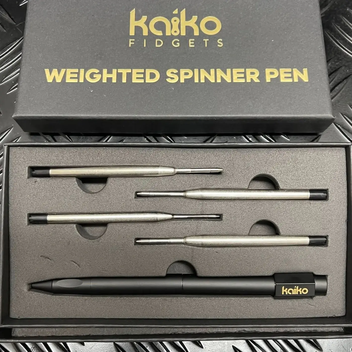 Black Weighted Spinner Pen 4 with refills